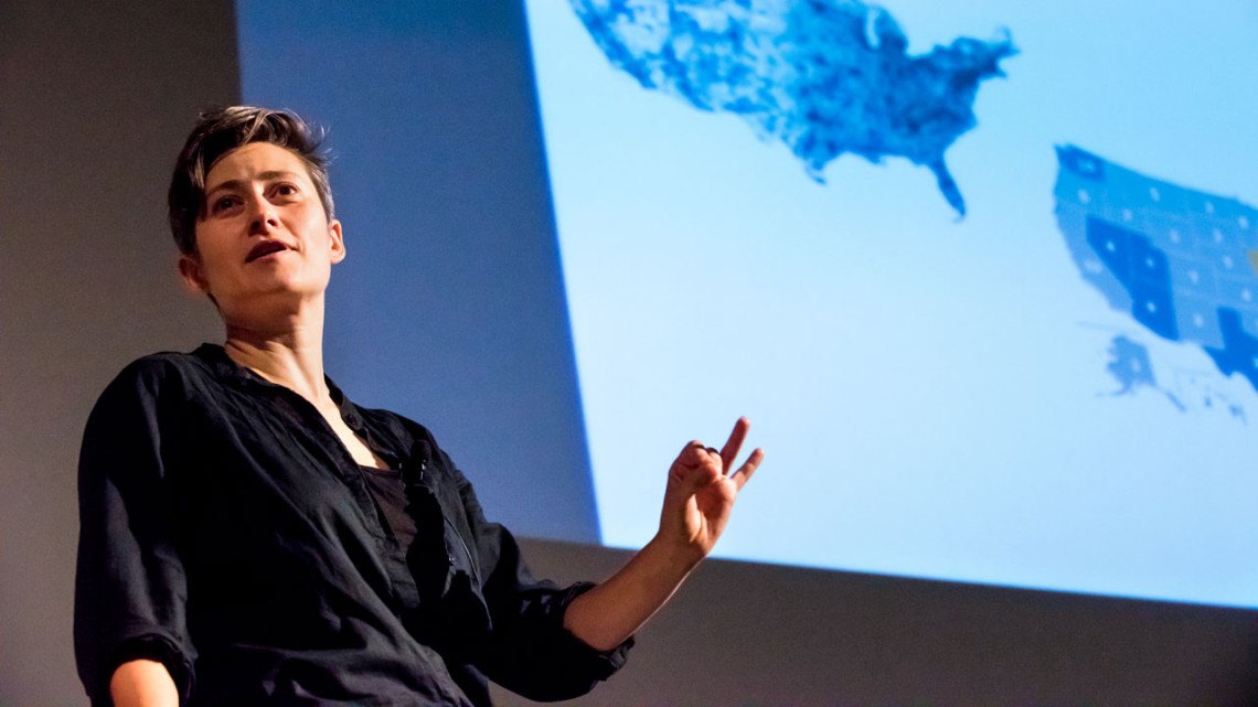 Woman presenting on stage