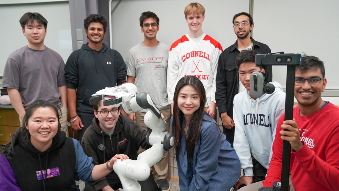 Credit:Patricia Waldron/Cornell University Lab members and robots in Sanjiban Choudhury’s group. Top row, left to right: Edward Duan ’26, Saksham Diwan ’26, Atiksh Bhardwaj ’26, Will Huey ’25 and master’s student Prithwish Dan ’24. Bottom row, left to ri