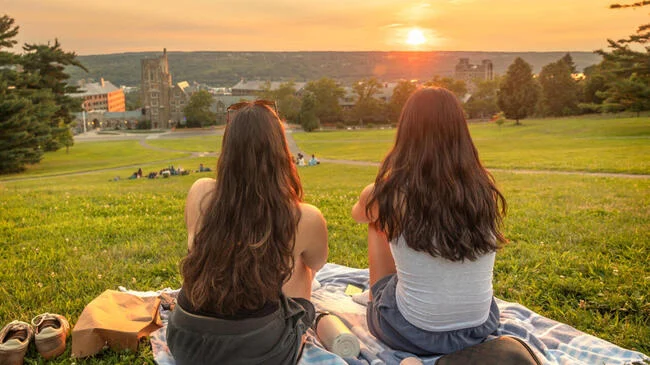 Students viewing the sunset on LIbe Slope