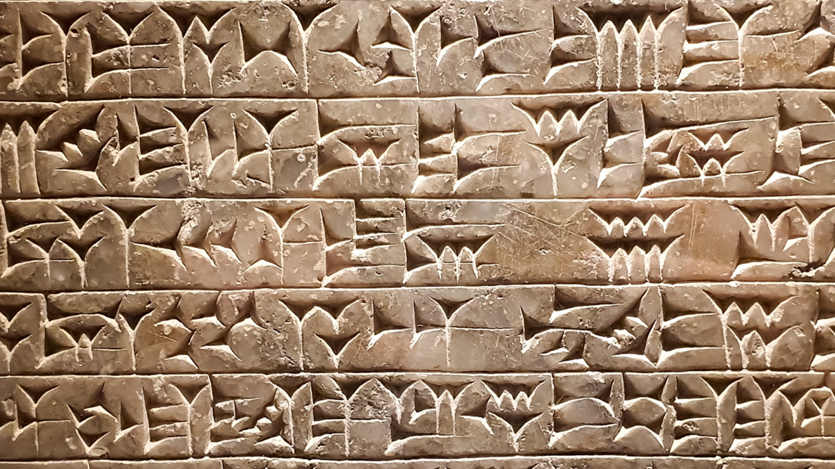 Ancient cuneiform writing script on the wall by Shutterstock contributor Dan Gabriel Atanasie