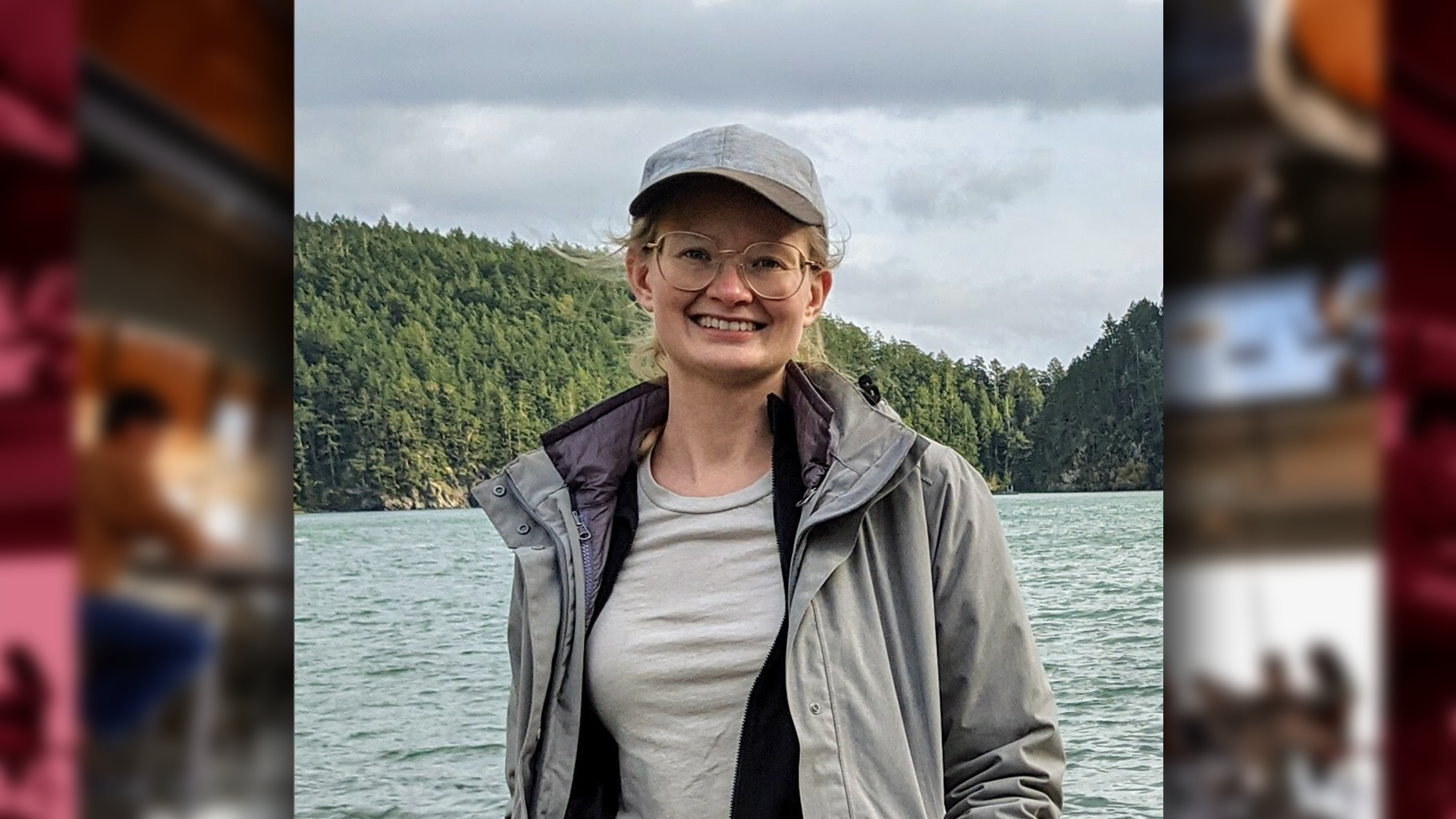 A color photo of a woman smiling for a photo