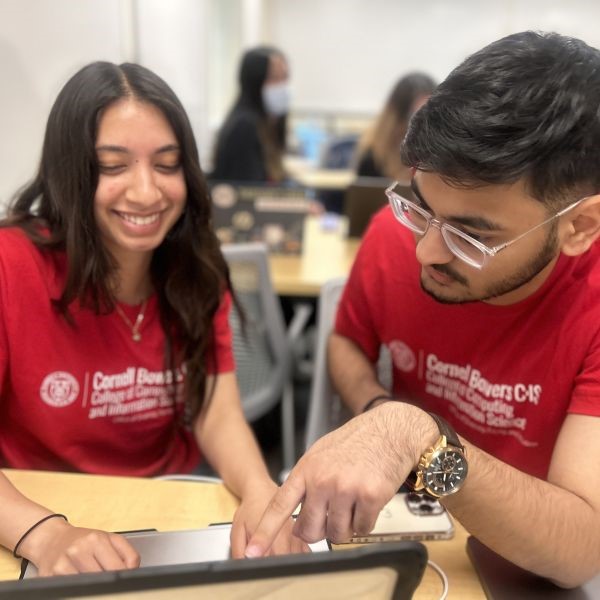 Two students looking at a computer
