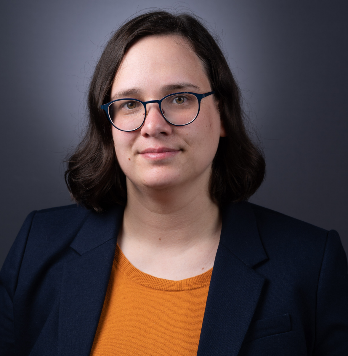 portrait of Woman with glasses looking at camera