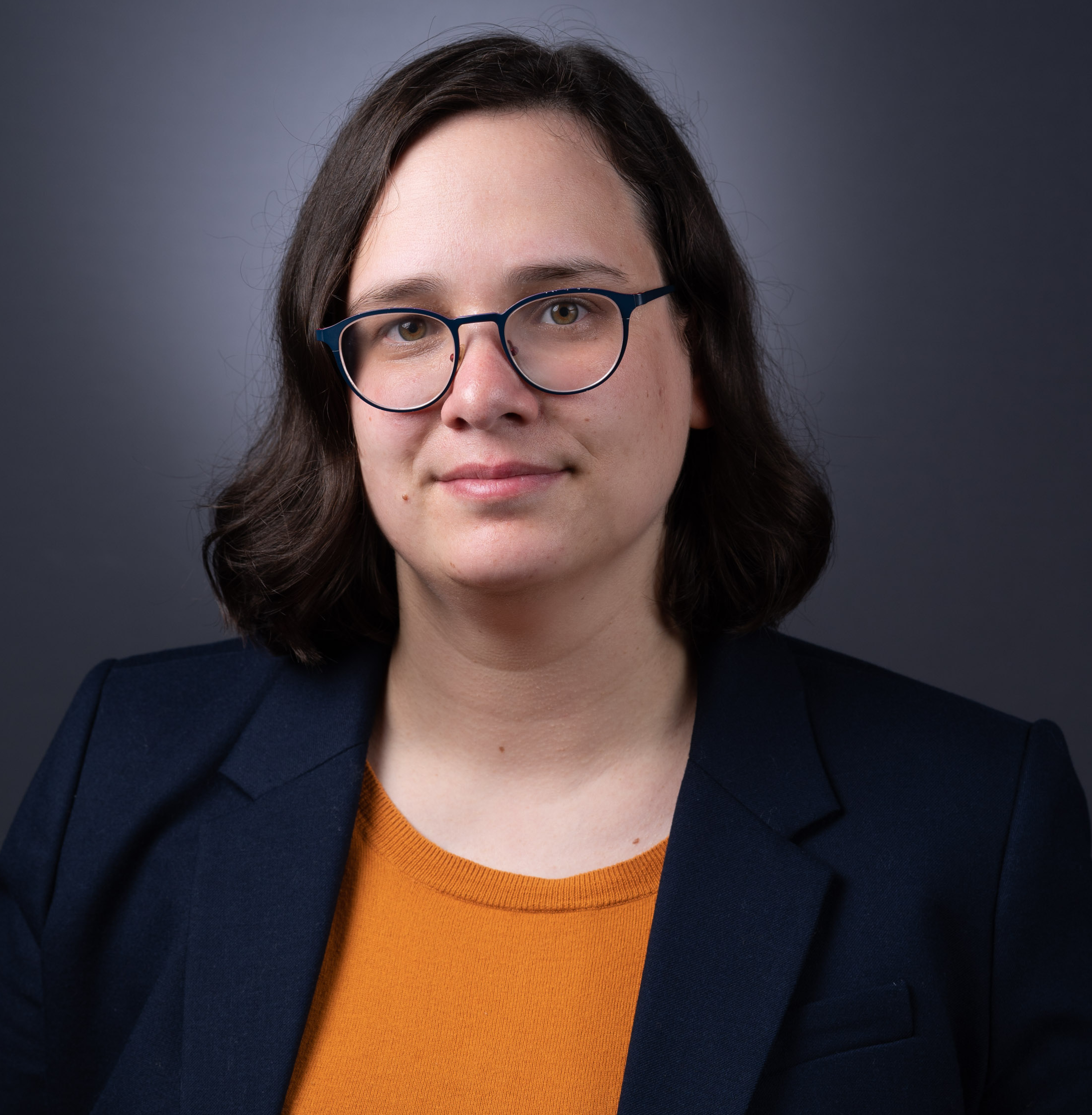 portrait of Woman with glasses looking at camera